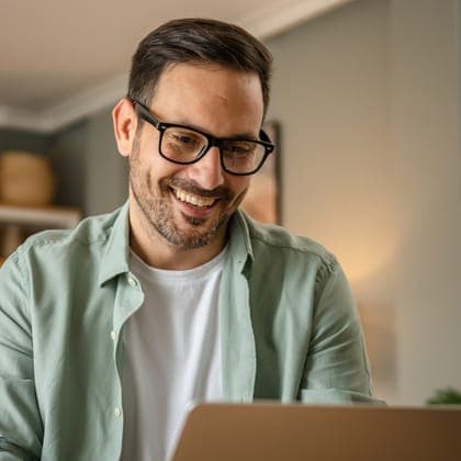 Man working at a laptop at home