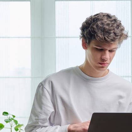 Young man working on a laptop at home