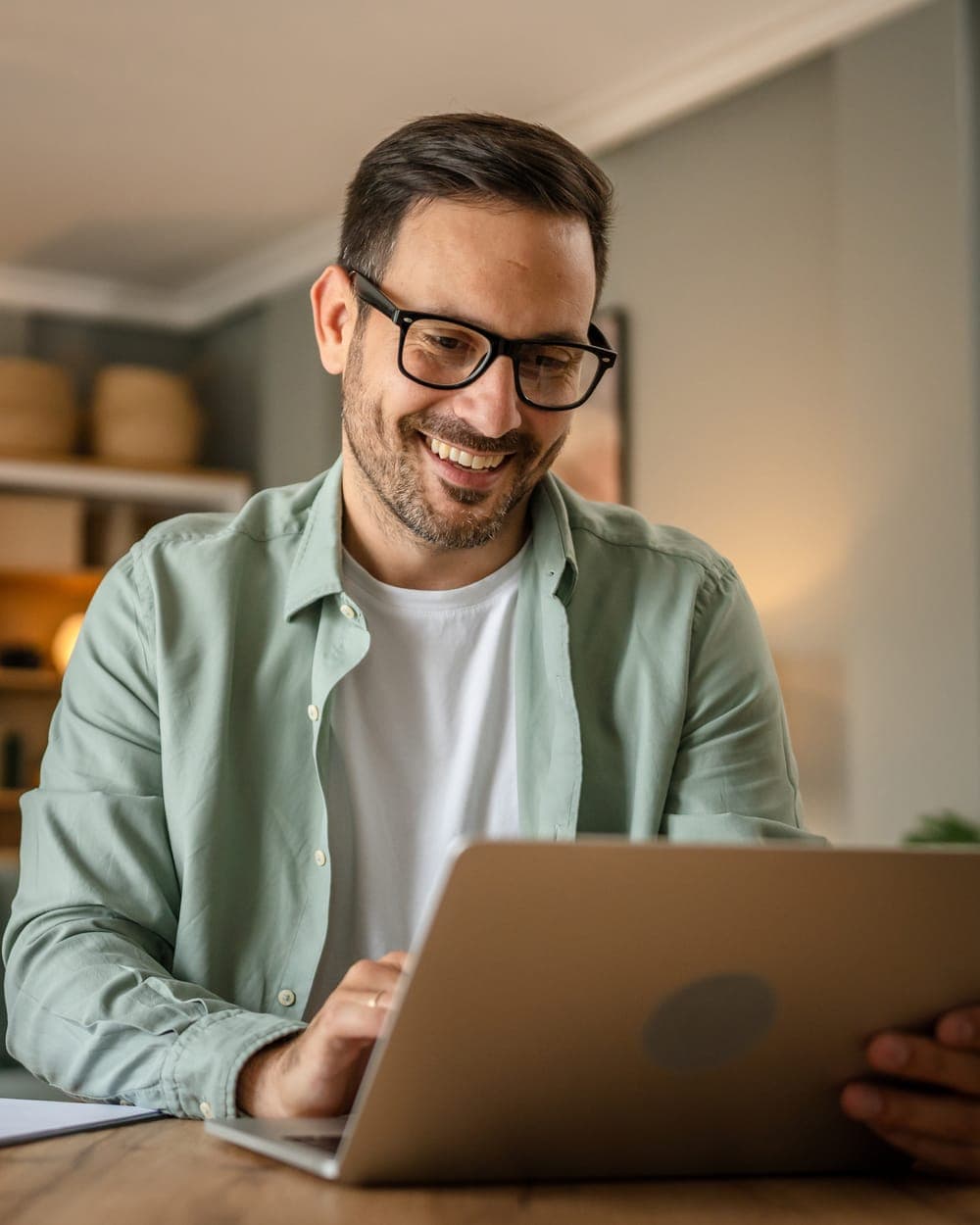 Man working at a laptop at home